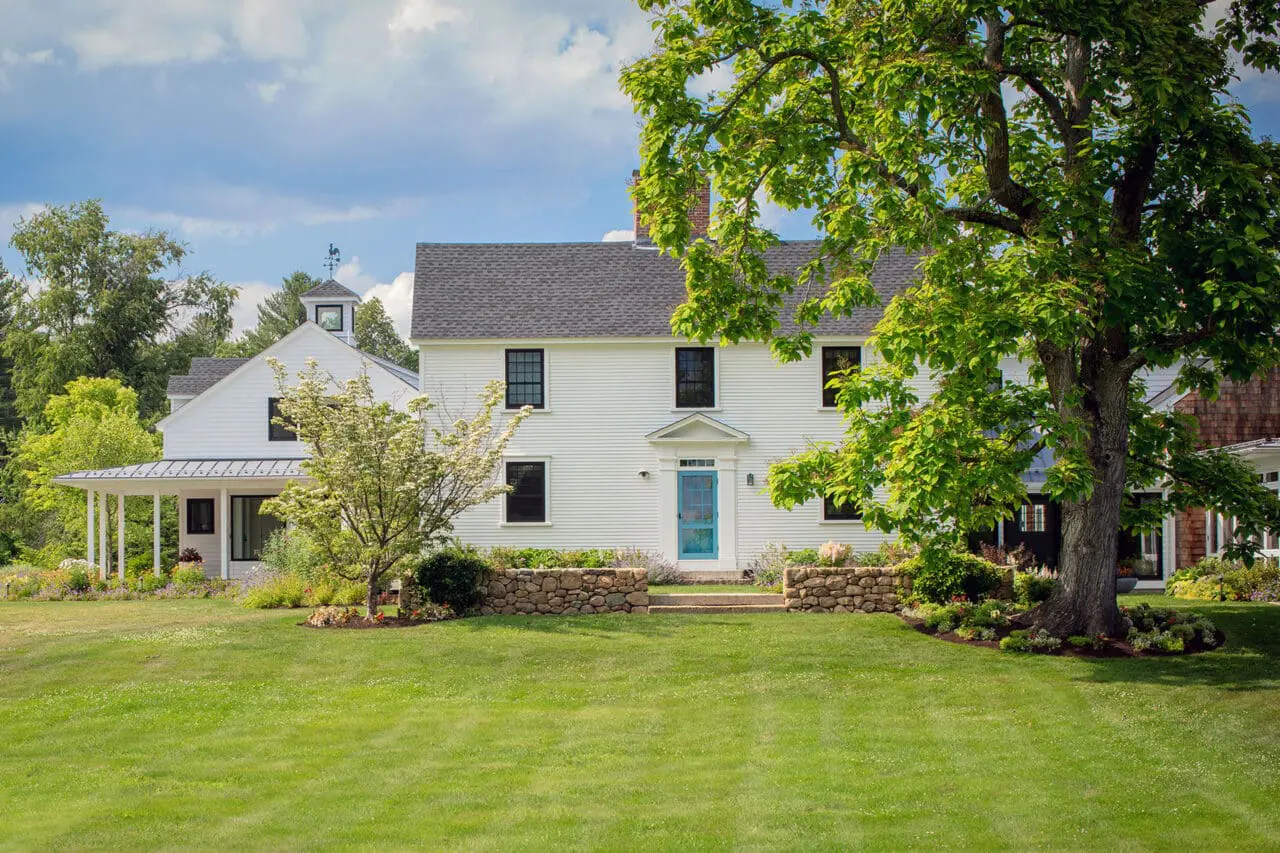 Carlisle, MA - Stone walls frame the expansive front lawn, reinforcing the estate’s pastoral roots and long-term stewardship. Photo: Michael J. Lee
