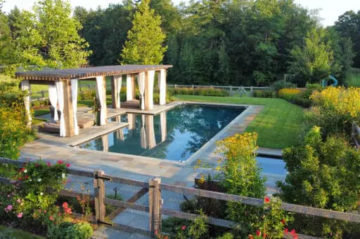 Carlisle, MA - The pool terrace transitions toward open meadow plantings, balancing refined outdoor living with the surrounding rural landscape. Photo: Michael J. Lee
