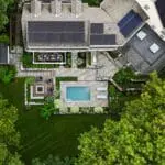From above, the full landscape plan reveals a carefully organized composition of pool terrace, fire feature, screened porch, and connecting garden spaces.