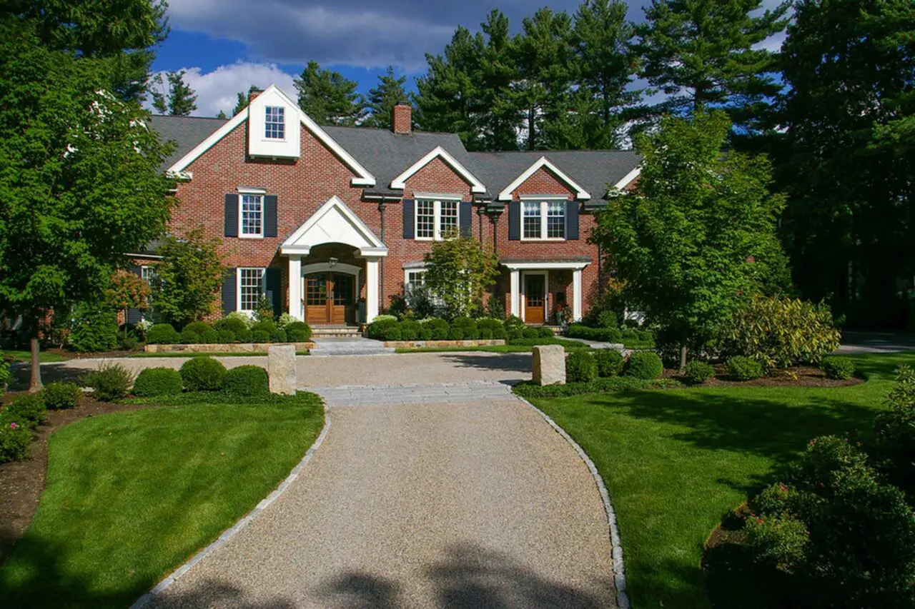 Wellesley Hills, MA - Stone transitions add definition and visual interest to the driveway, creating a refined connection between the drive, walkways, and surrounding landscape.