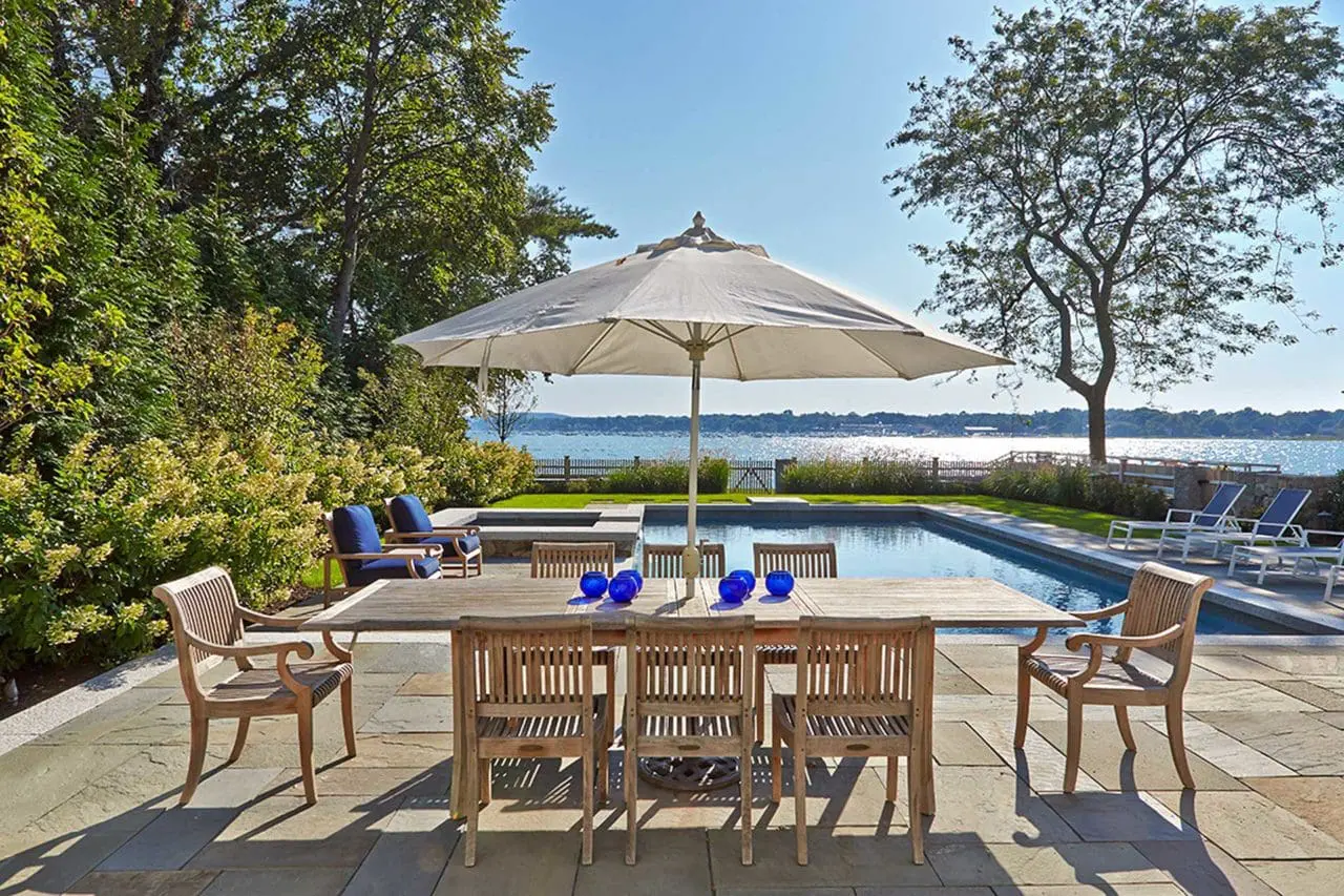 Duxbury, MA - This bluestone pool deck offers both ample dining space as well as beautiful harbor views.