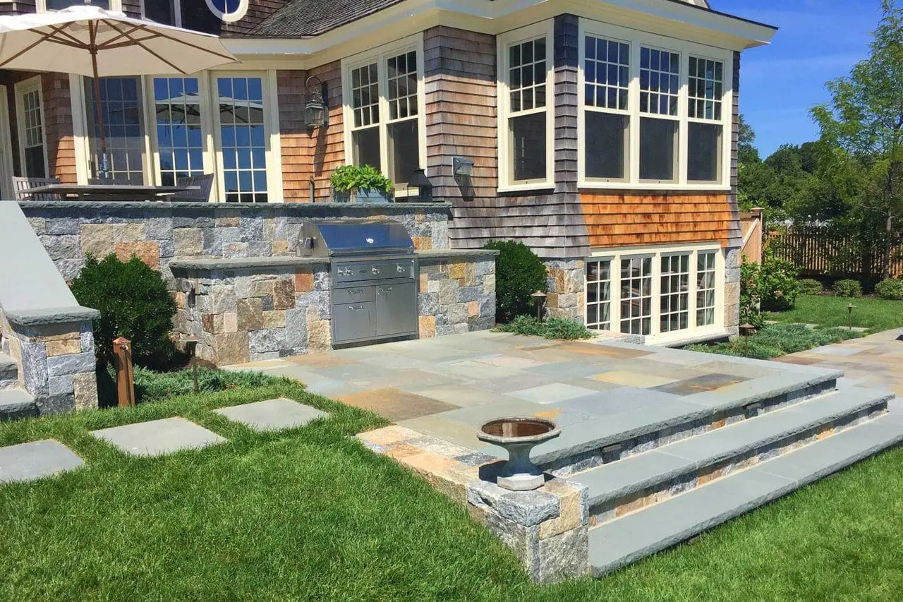 Duxbury, MA - Corinthian granite walls double as counter space for this built in grill.