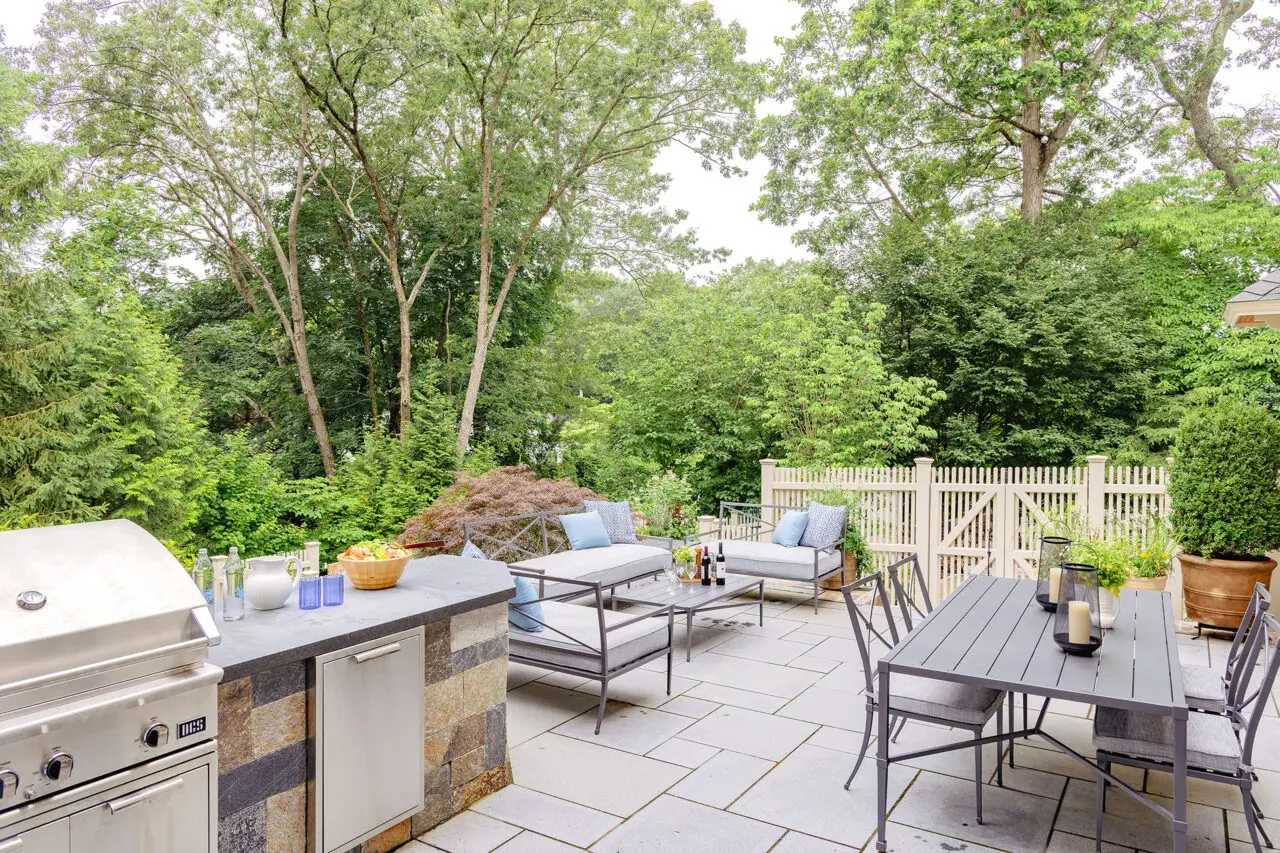 Outdoor cooking and dining space designed for hands-on grilling and relaxed meals, encouraging more time spent outside.