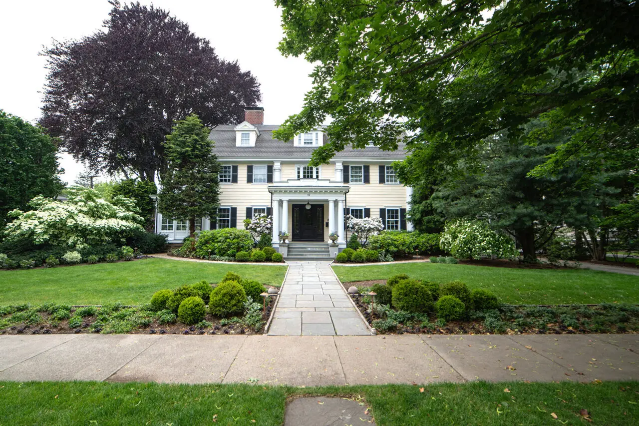 Formal bluestone front walkway delivers timeless elegance and durability for a traditional Wellesley estate.