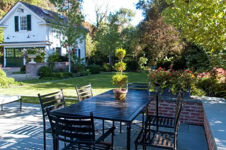 transformation - after - carriage house stone patio and gardens