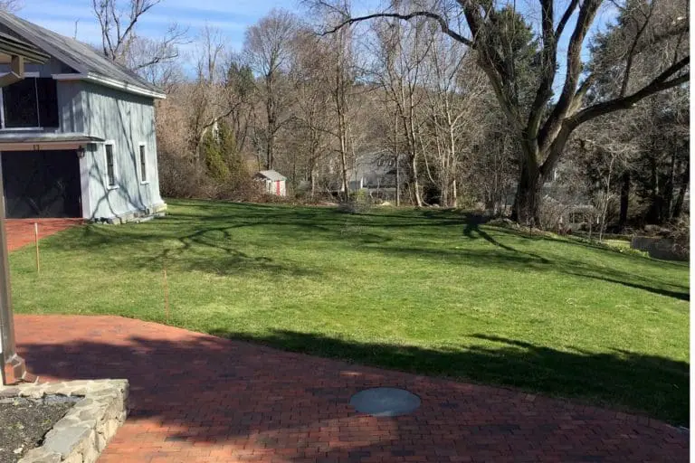transformation - before - carriage house brick walkway and yard