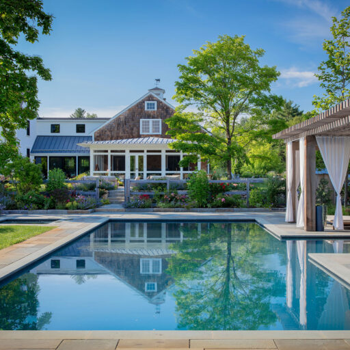 Carlisle, MA - A cedar pergola anchors the pool terrace, reinforcing agrarian character while providing shade and structure. Photo: Michael J. Lee