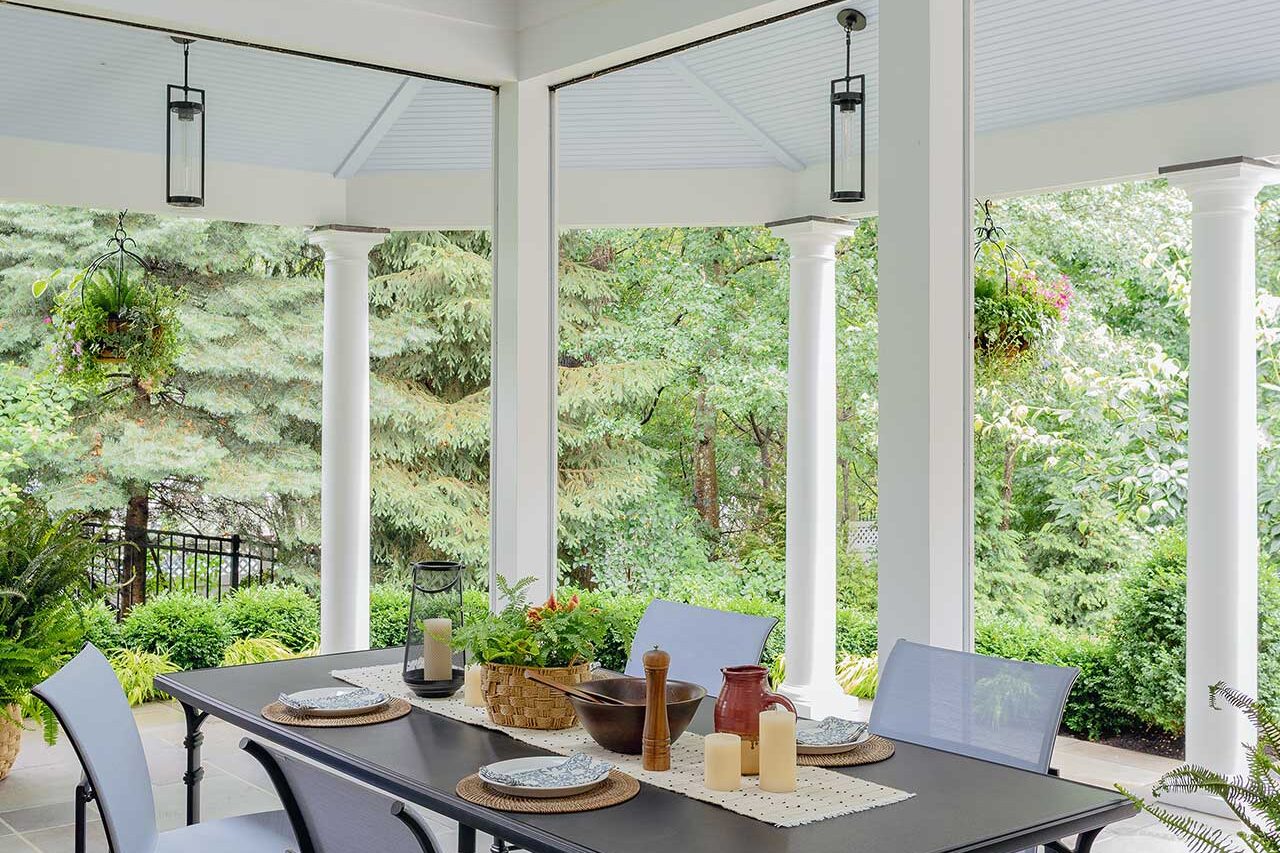 Natural light, generous paving, and views into the surrounding landscape make this screened porch an inviting extension of the garden, copyright: Michael J Lee