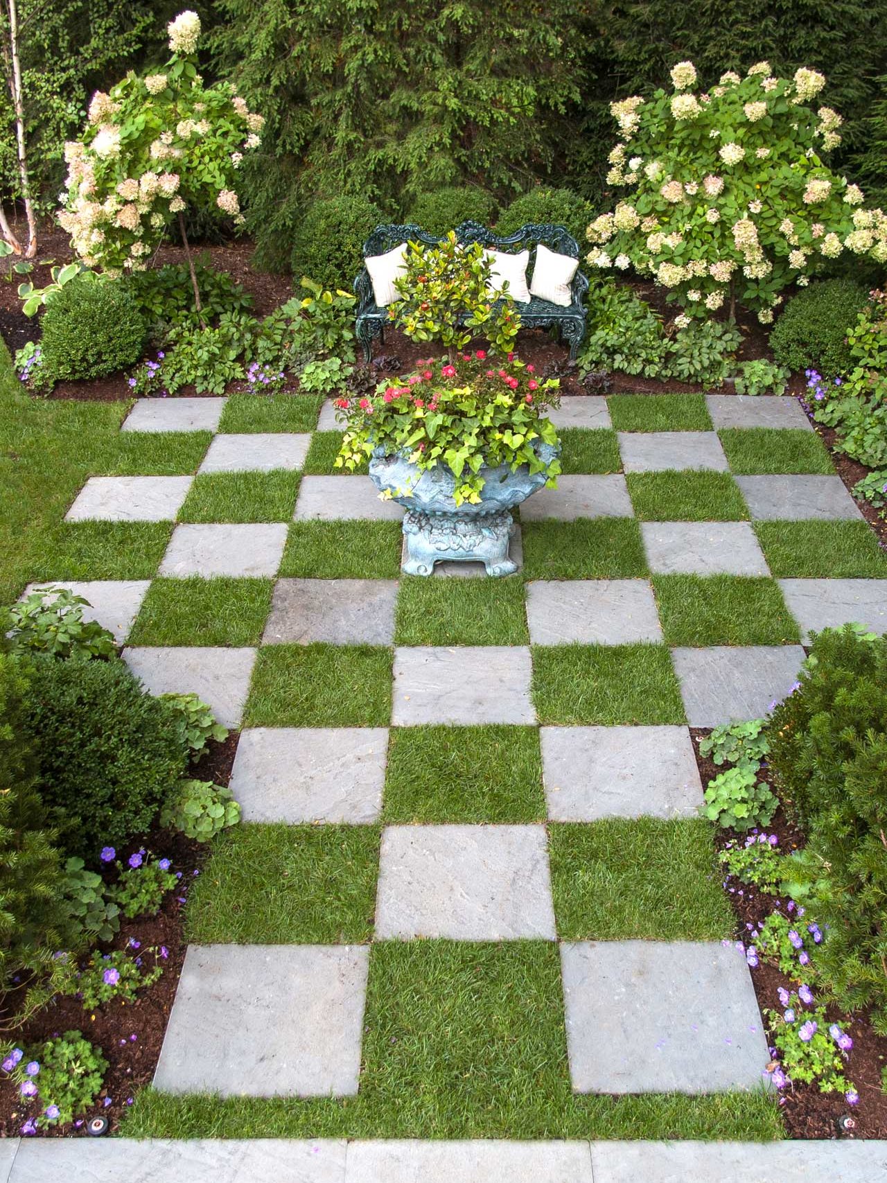 checkerboard design lawn with planters