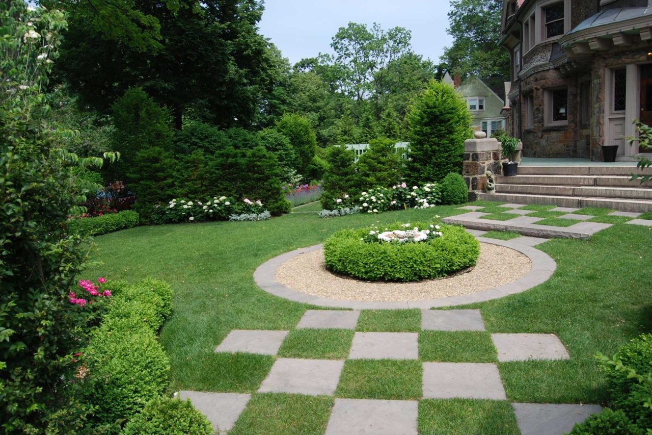 Brookline, MA - A checkerboard pattern in the lawn adds a unique interest to the garden.