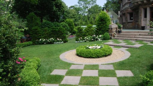 Brookline, MA - A checkerboard pattern in the lawn adds a unique interest to the garden.