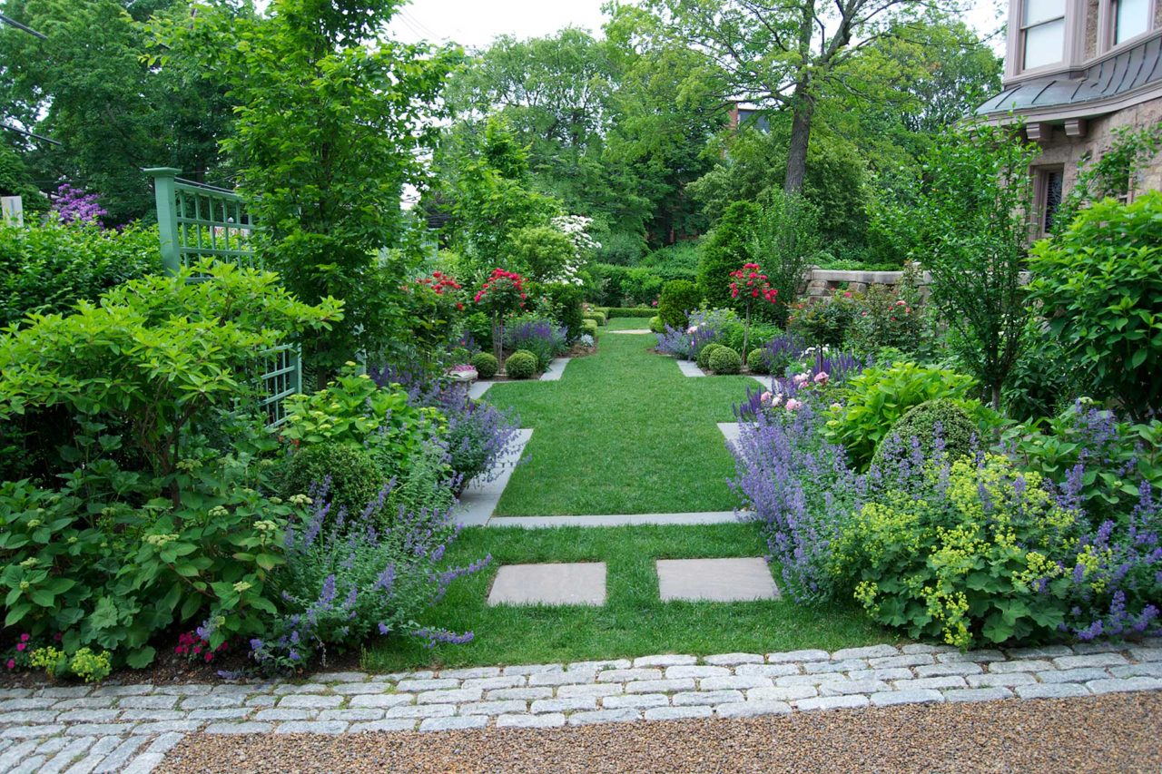 Brookline, MA - Summer in full swing provided by a blend of perennials, flowering trees and shrubs, and evergreen shrubs.