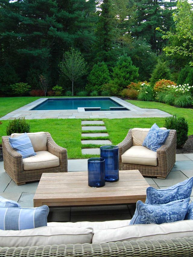 Dover, MA - A tranquil pool and spa provide the back drop to outdoor fireplace and seating.