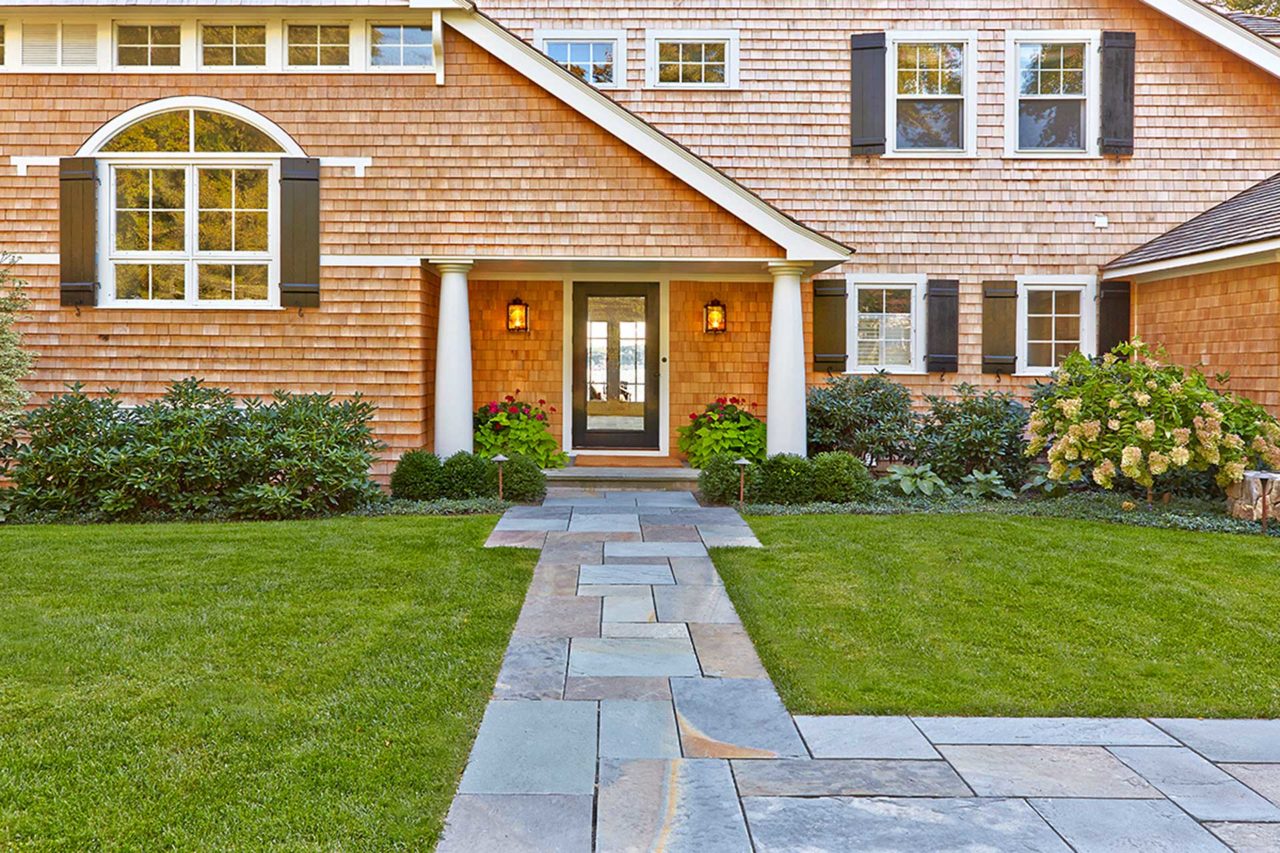 Duxbury, MA - Natural cleft full color bluestone leads to the way along emerald green lawns to the home's main entrance.