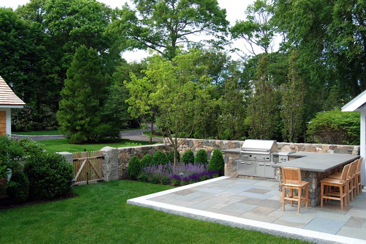 Duxbury, MA - stone patio with outdoor eating, grill, and granite wall