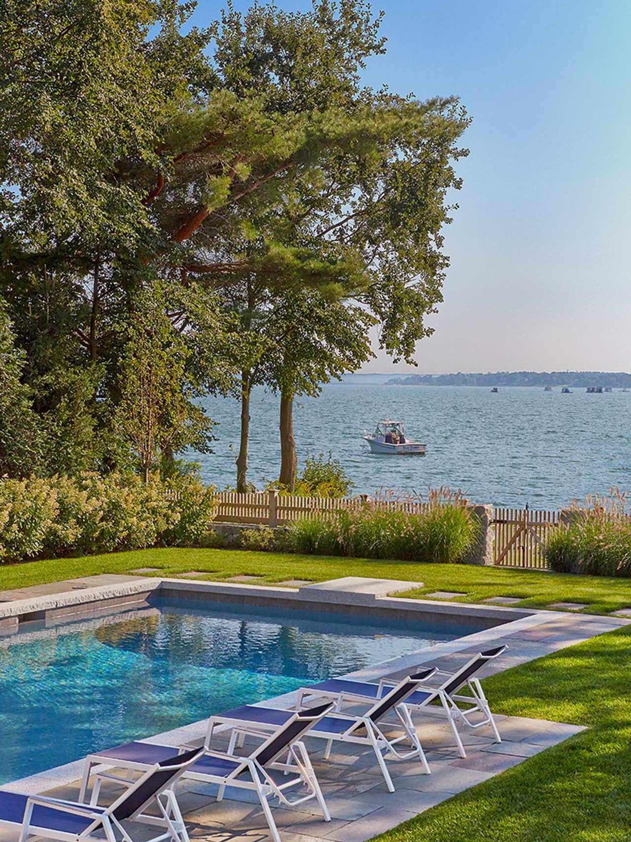 Duxbury, MA - Amazing ocean views just beyond the clean lines of the pool and landscape.