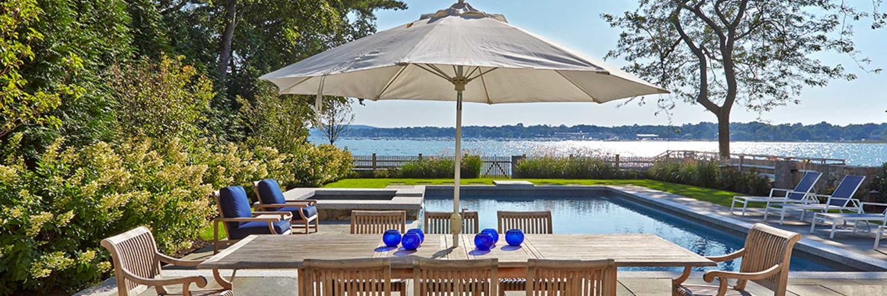 Duxbury, MA - This bluestone pool deck offers both ample dining space as well as beautiful harbor views.