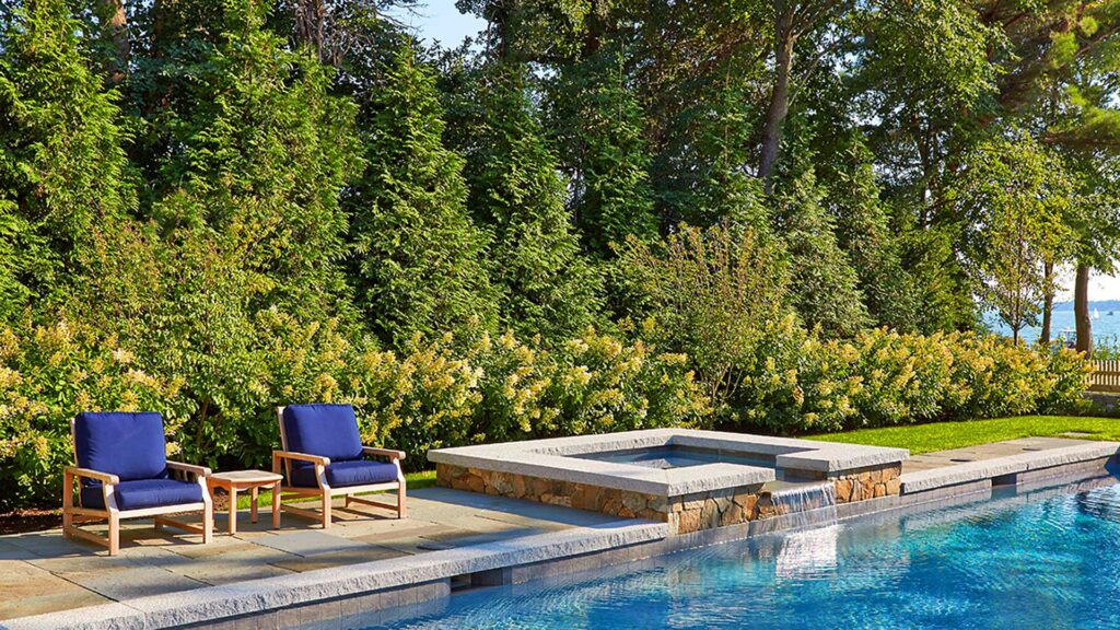 Duxbury, MA - A mixed planting provides both privacy screening a beautiful backdrop for the pool.