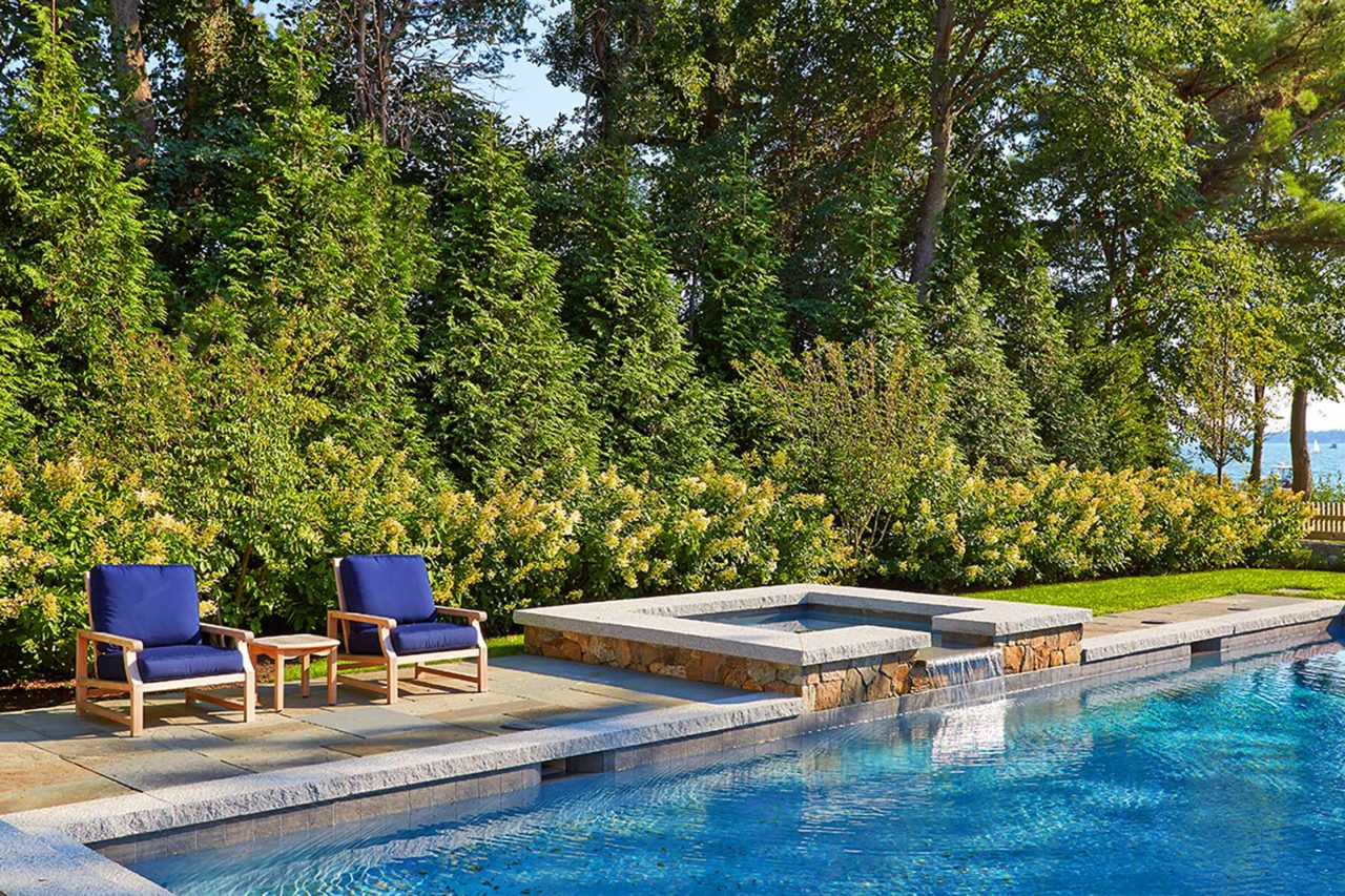 Duxbury, MA - A mixed planting provides both privacy screening a beautiful backdrop for the pool.