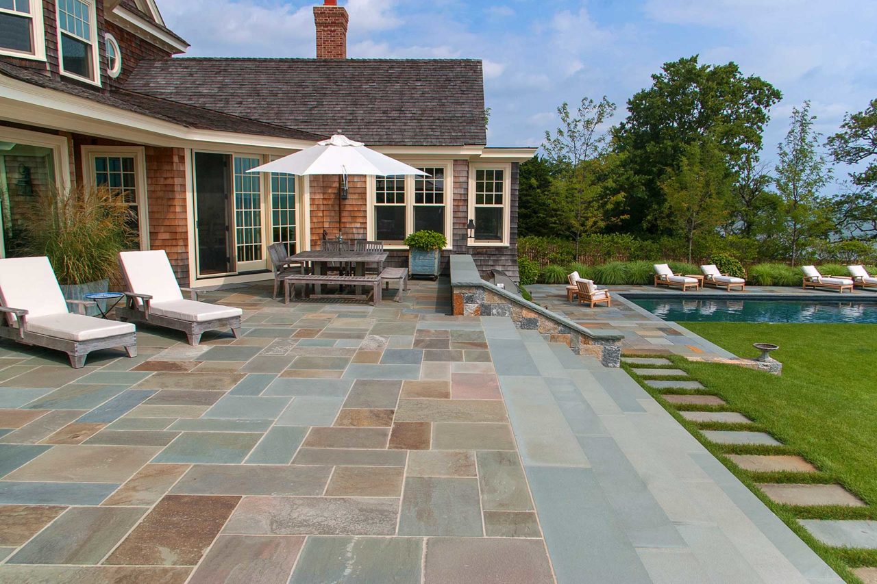 Duxbury, MA - Natural cleft full color bluestone patio provides ample outdoor gathering space, while true blue stair treads lead the way to the lawn.