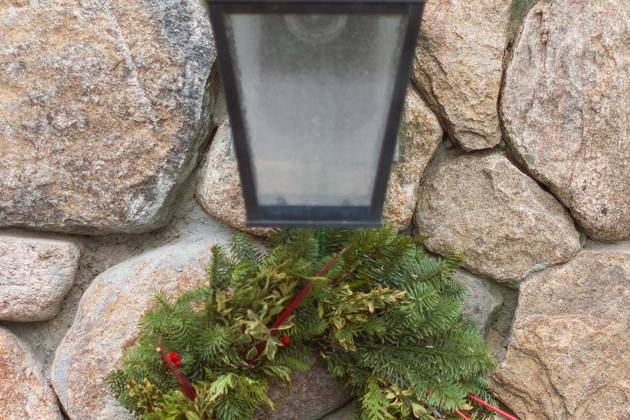 This mixed evergreen wreath offers a more natural holiday look, with red berry accents adding just enough seasonal color.