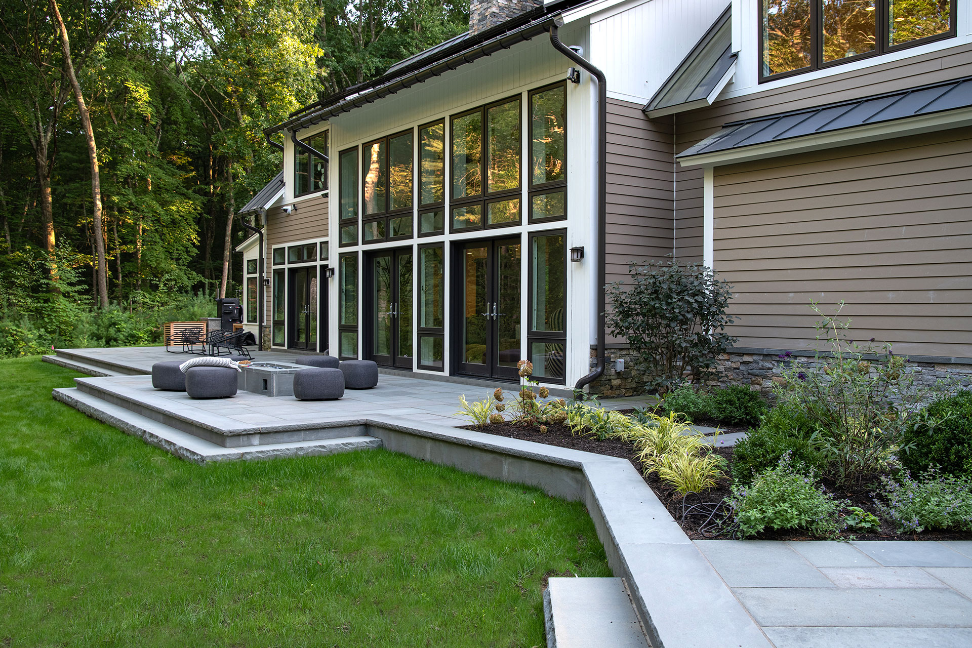 Wood deck terrace with mature shade tree feels like a private garden room, perfect for morning coffee and casual outdoor lounging.