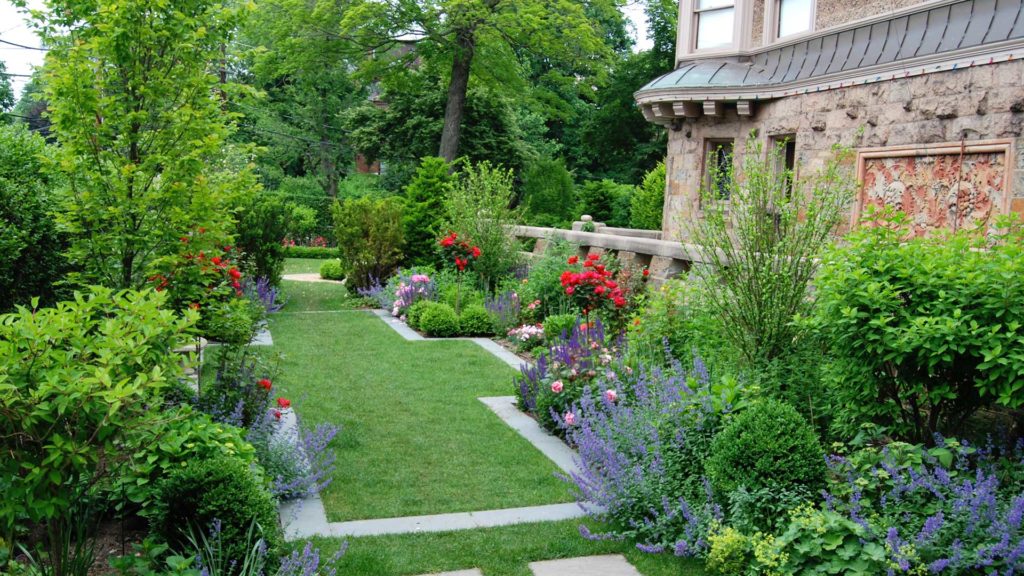 transformations - after - updated yard with plantings and gardens