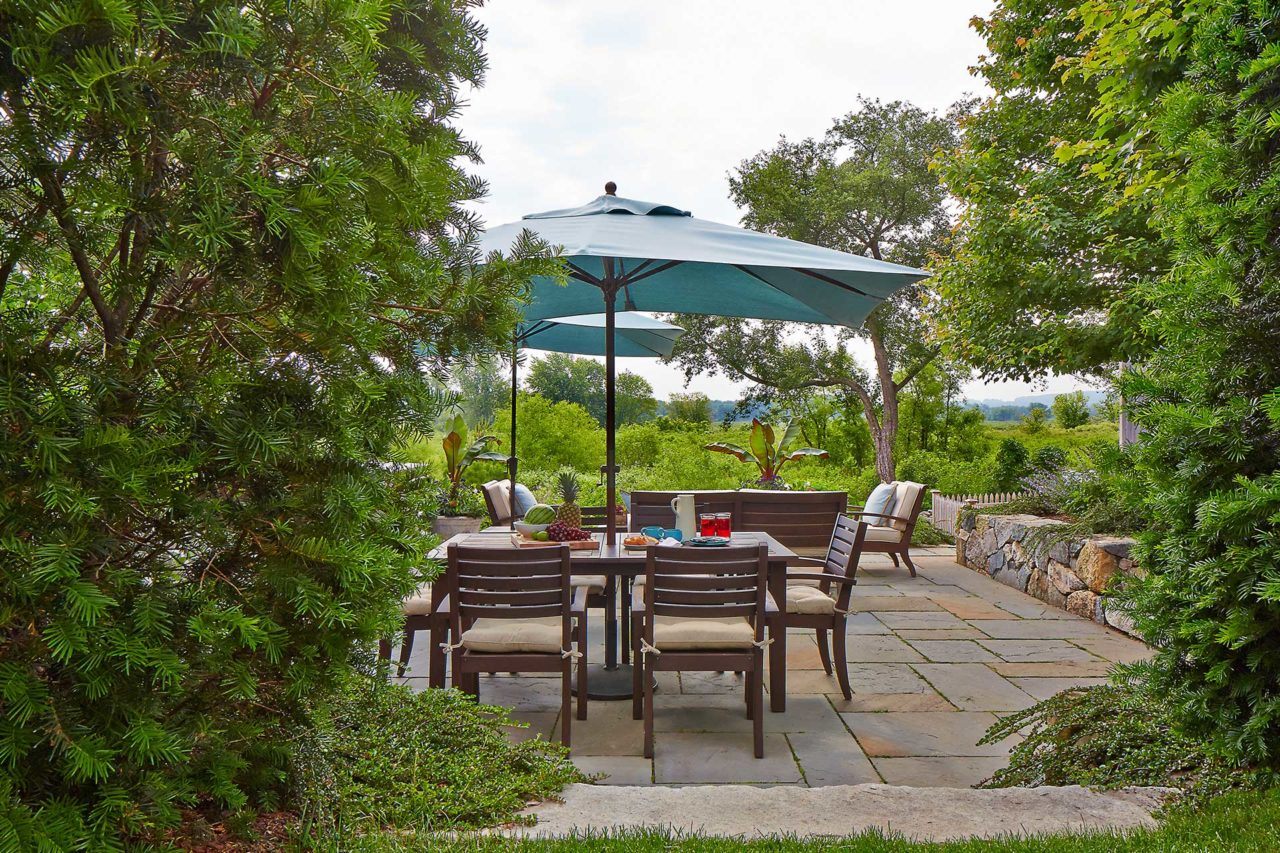 wayland patio with table and sudbury river view