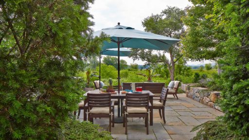 wayland patio with table and sudbury river view