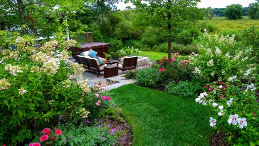 wayland patio with fire pit and gardens