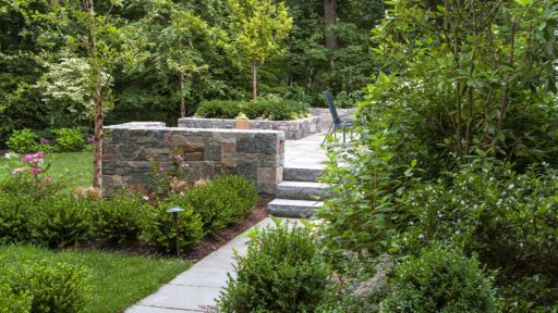 Wellesley, MA - Lushly planted beds of boxwood, holly, magnolia, and birch.